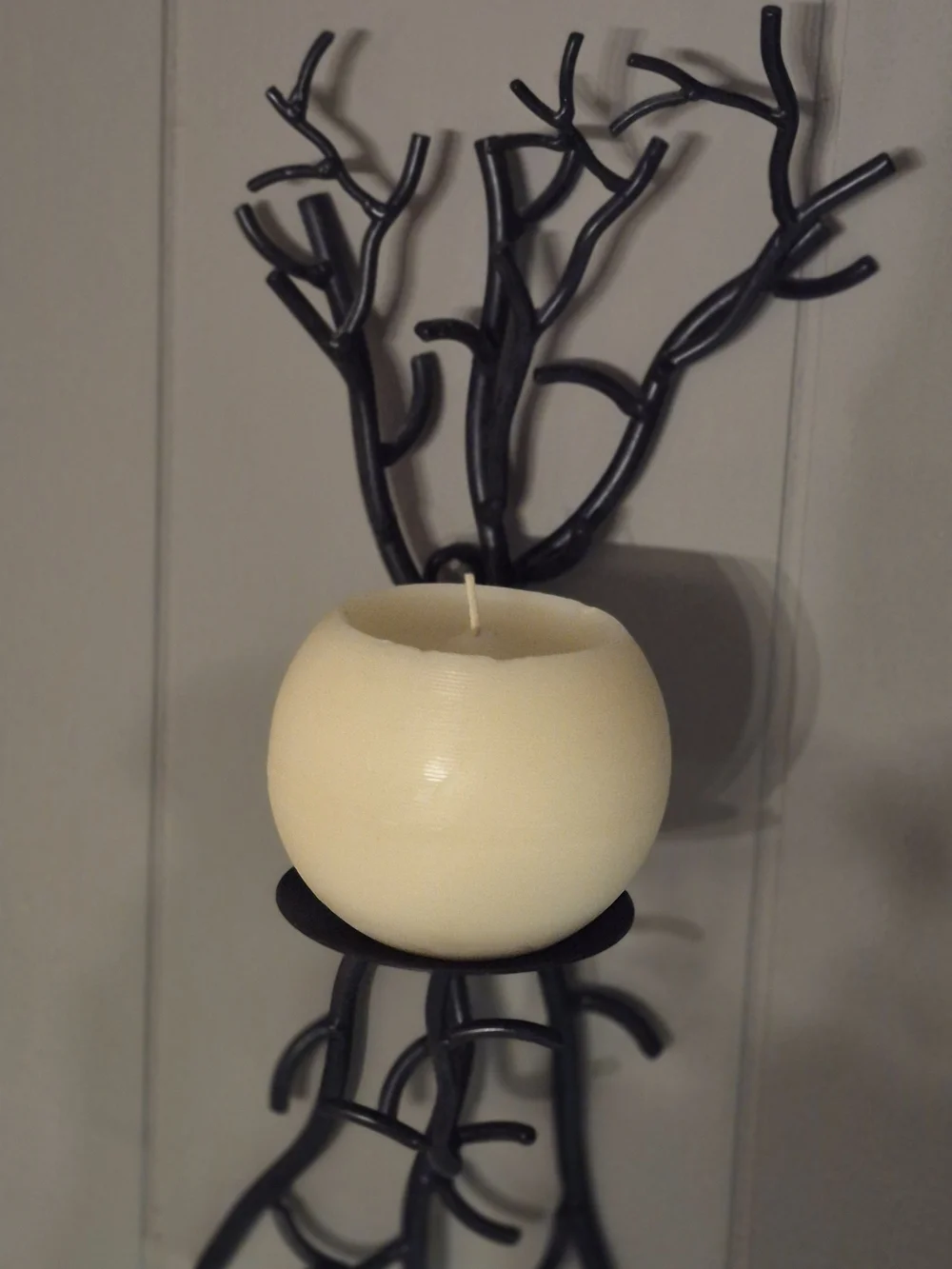 Wall-Mounted Brown Metal Branch Sconce with Cream Candle Holder. Its 17